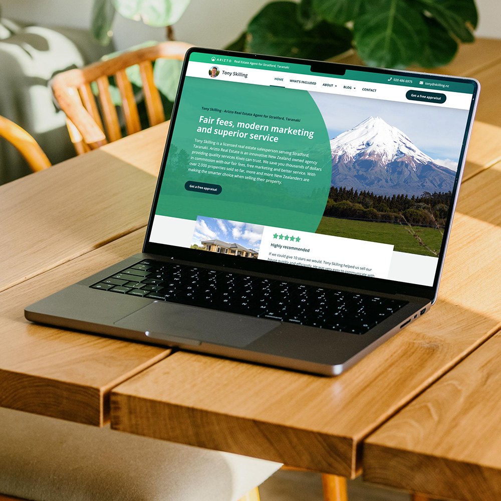 Taranaki Media laptop showcasing client website for Arizto Real Estate